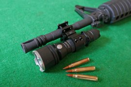 Mounting for flashlight on barrel
